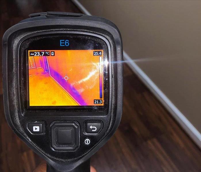 Thermal camera scanning a wall.