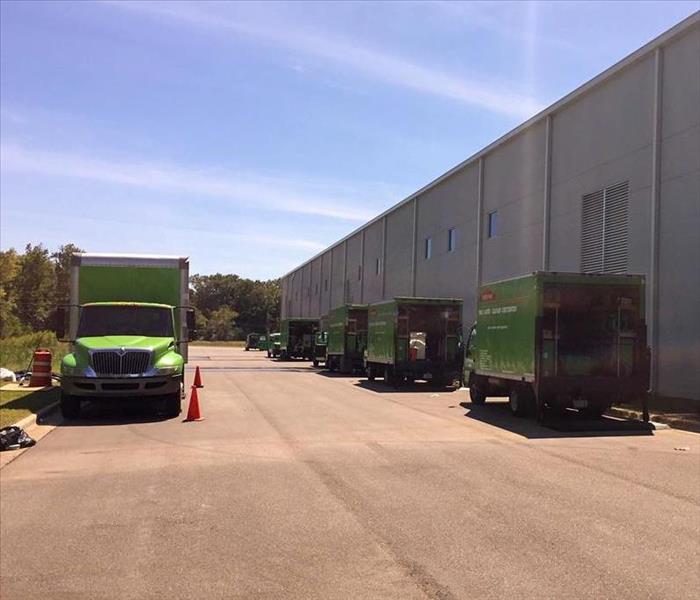 SERVPRO trucks parked behind a Dawson County business